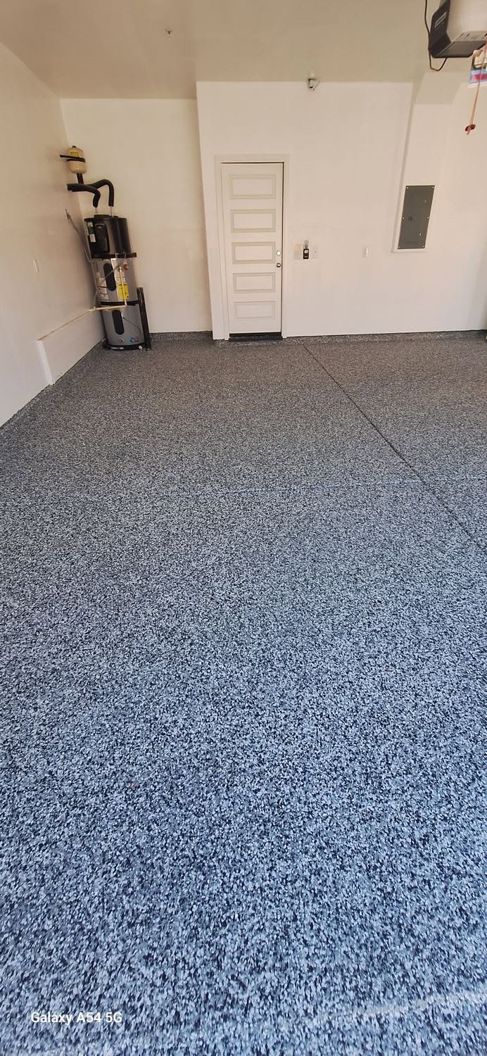 Freshly finished blue flake epoxy garage floor in a new build