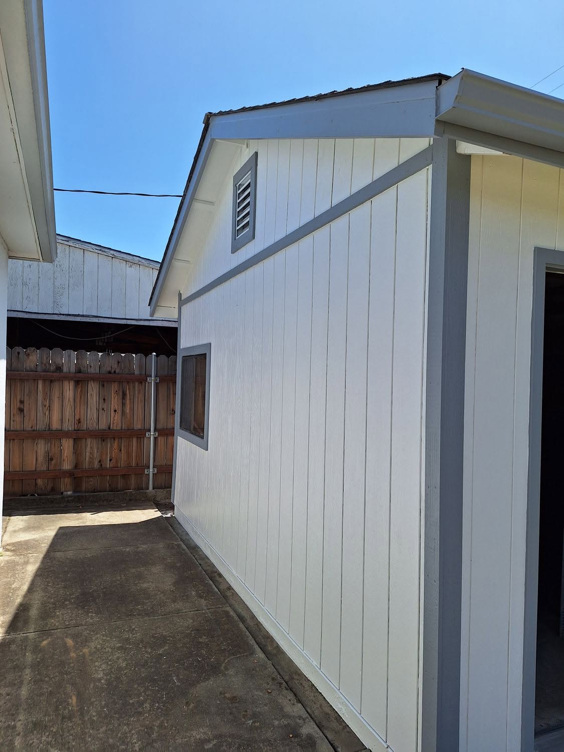 White board and batten siding with warm gray trim