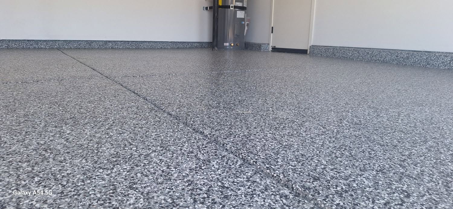 Close-up of dark flake epoxy garage floor detail