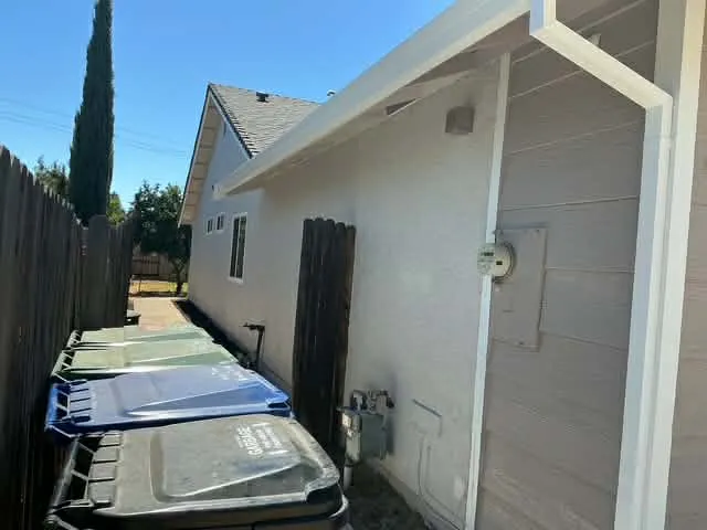 White siding and stucco side elevation repaint