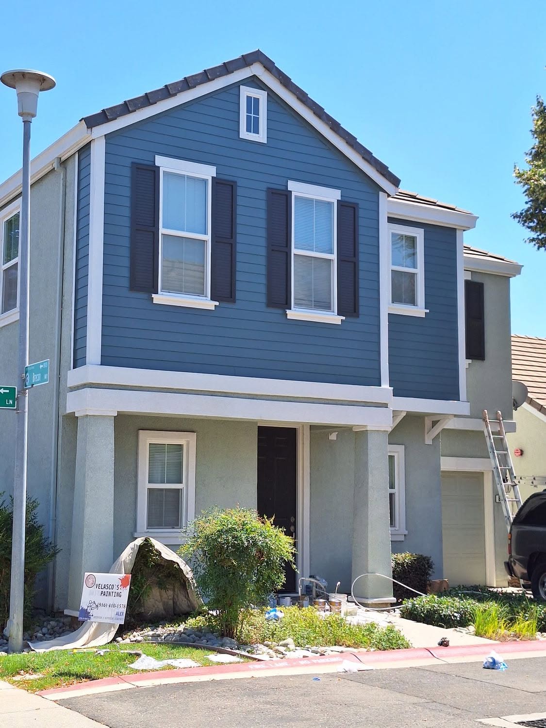 Velasco's Painting yard sign on a job site